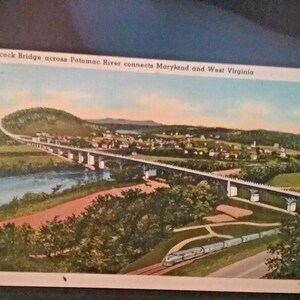 El puente Hancock de postal a través del río Potomac conecta Maryland y Virginia Occidental