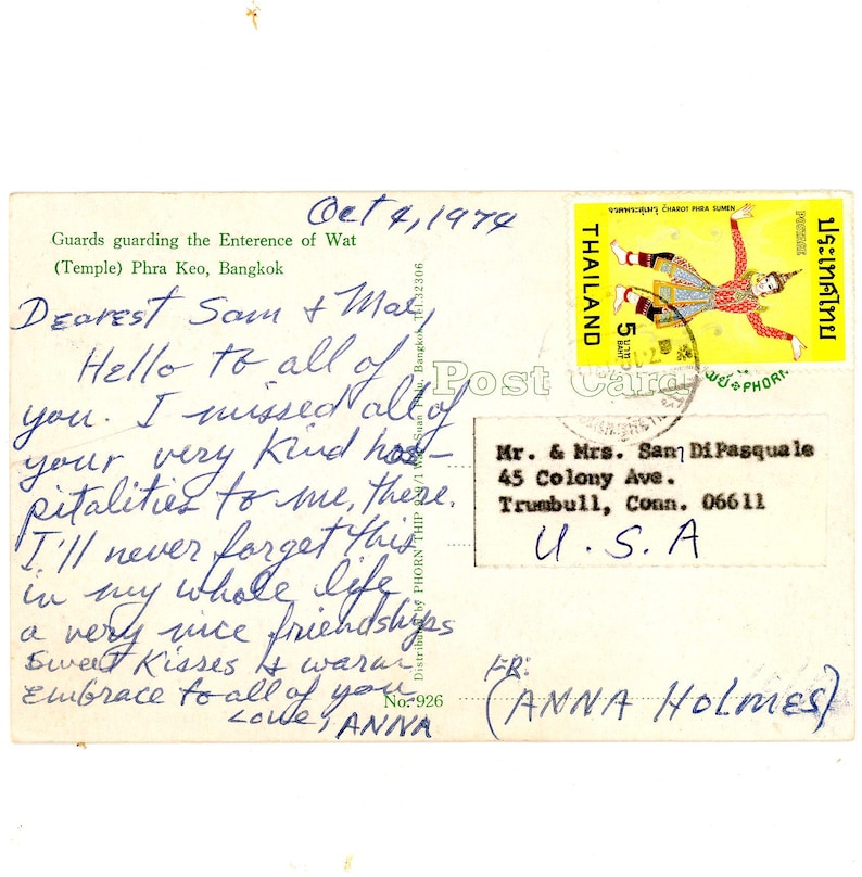 May include: A vintage postcard with a handwritten message that reads "Dearest Sam & Mat Hello to all of you. I missed all of your very kind hospitality to me, there. I'll never forget this in my whole life. Sweet Kisses & warm embrace to all of you. ANNA No. 926". The postcard also features a stamp from Thailand with a picture of a dancer in a traditional costume.