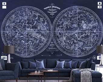 May include: A navy blue sectional sofa with a chaise lounge, two end tables, and two lamps. The wall behind the sofa features a vintage celestial map with constellations in white on a dark blue background. The map is titled "Visible Heavens, Equatorial, &c. by James Ferguson, F.R.S."