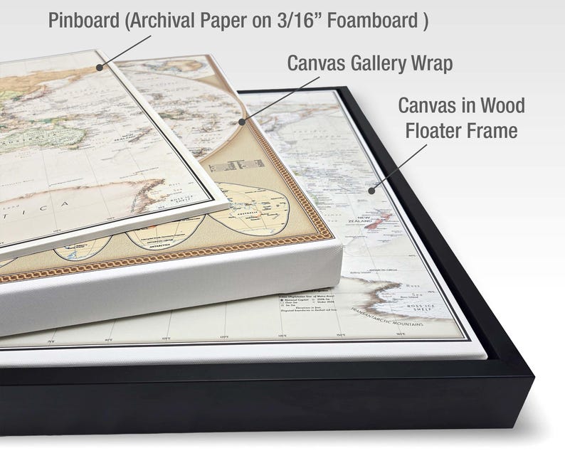a collection of framed artworks, including a map on a foamy paper, a canvas gallery wrap, and a canvas in a wood floater frame.