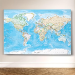 May include: A detailed world map with a blue ocean background and various countries in different colors. The map includes the continents, oceans, and geographical features. The title "THE WORLD" is at the bottom.