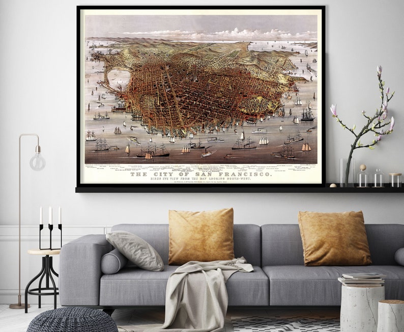 May include: An antique map of San Francisco, California, showing the city from the bay looking southwest. The map is printed in brown, black, and white ink on a white background. The map is framed in a black frame.