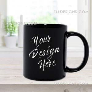 11 oz black mug mockup in a clean, modern kitchen with plants background