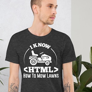 May include: A dark heather grey t-shirt with a white graphic of a lawnmower and the text "I know <HTML> How to mow lawns".