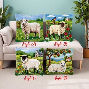 May include: Four decorative throw pillows with sheep designs. Each pillow features a different pastoral scene with a sheep, flowers, and a house. The pillows are labeled "Style A", "Style B", "Style C", and "Style D". The pillows are on a white couch.