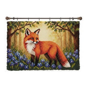 May include: A handcrafted tapestry featuring a red fox in a forest scene. The fox has a white chest and stands among blue flowers. The background depicts trees and sunlight, with a dark brown rod and decorative finials at the top.