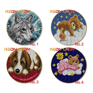 May include: Four round rug kits with different animal designs. The kits feature a wolf, a teddy bear, a puppy, and a teddy bear in pajamas. Each kit is labeled with a number from 1 to 4.