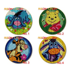 May include: Four round embroidery kits featuring cartoon characters from Winnie the Pooh. The kits are numbered 1 through 4. Kit 1 features Eeyore, Kit 2 features Winnie the Pooh, Kit 3 features Tigger, and Kit 4 features Eeyore.