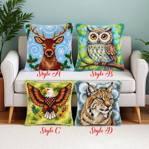May include: Four decorative throw pillows with animal designs. Style A features a reindeer with antlers on a blue background. Style B shows an owl on a branch. Style C displays an eagle with outstretched wings. Style D depicts a lynx.