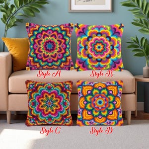 Puede incluir: Cuatro cojines cuadrados con coloridos diseños de mandala. Los estilos A, B, C y D presentan patrones intrincados en tonos de rosa, azul, naranja y verde. Los cojines se exhiben en un sofá beige, ofreciendo un acento decorativo.