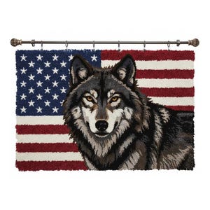 May include: A decorative wall hanging featuring a detailed image of a wolf against a backdrop of the American flag. The wolf is depicted in shades of gray, black, and brown, with piercing yellow eyes. The flag's stars and stripes are clearly visible.