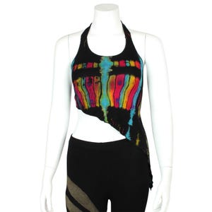 May include: A black halter top with a rainbow tie-dye pattern. The top is asymmetrical and has a short, cropped length.