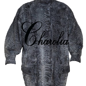 May include: A gray fur coat with a high collar and a black button closure. The coat has two pockets on the front and the word "Charolia" is written in black cursive on the front.