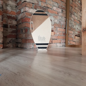 Surf style balance board a natural wooden roller covered with cork.