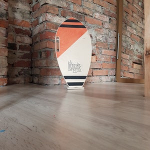 Surf style balance board a natural wooden roller covered with cork.