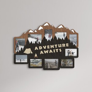 May include: A wooden photo frame with a mountain silhouette design and the text "Adventure Awaits". The frame has multiple openings for photos and is displayed on a wall above a wooden entertainment center.