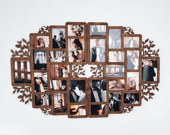 May include: A large, oval-shaped wooden collage photo frame featuring multiple rectangular openings for photographs. The frame is decorated with intricate laser-cut leaf patterns along the outer edges and a central branch design.