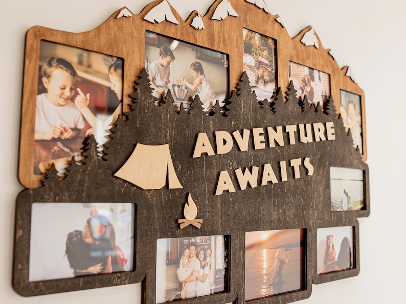 May include: A wooden photo frame with a mountain silhouette design. The frame has multiple openings for photos and features the text "Adventure Awaits".