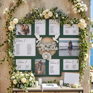 May include: A dark green wedding seating chart board featuring white text, guest lists for tables one through seven, two photographs of a couple, white dove cutouts, a central circular moon-like accent, and a white nautilus shell decoration.