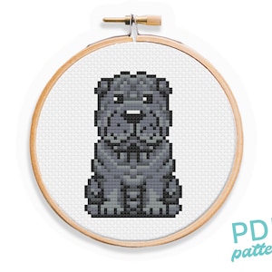 May include: Cross stitch pattern of a gray Shar-Pei dog sitting with its tongue out. The pattern is in a wooden embroidery hoop. The text "PDF pattern" is in the lower right corner of the image.