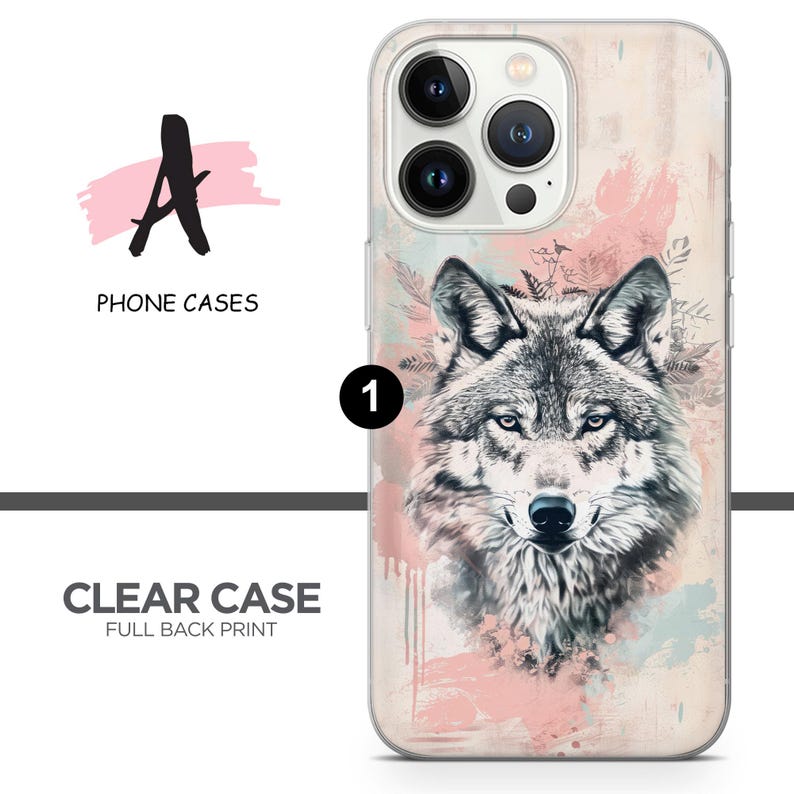 May include: A clear phone case with a full back print of a wolf's face in a watercolor style with pink and blue accents. The wolf's face is centered on the case and the background is a light pink and blue watercolor wash.