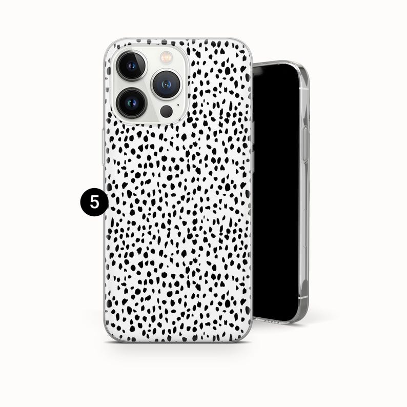 May include: A smartphone case featuring a white background with a dense pattern of irregular black spots. The case has a cutout for a triple-lens camera system on the back. A small black circle with the white number 5 is positioned on the left side.