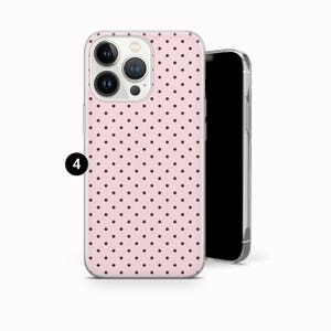 May include: A light pink smartphone case featuring a repeating pattern of small dark brown polka dots. The case is shown on a smartphone with a triple-lens camera array visible on the back. A black circular icon with the number 4 is on the left side.