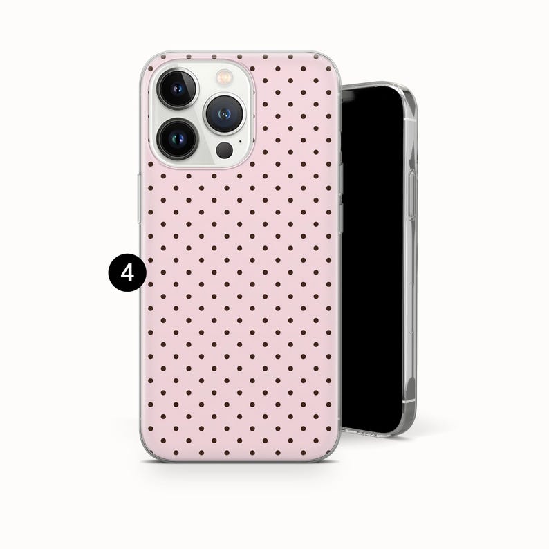 May include: A light pink smartphone case featuring a repeating pattern of small dark brown polka dots. The case is shown on a smartphone with a triple-lens camera array visible on the back. A black circular icon with the number 4 is on the left side.