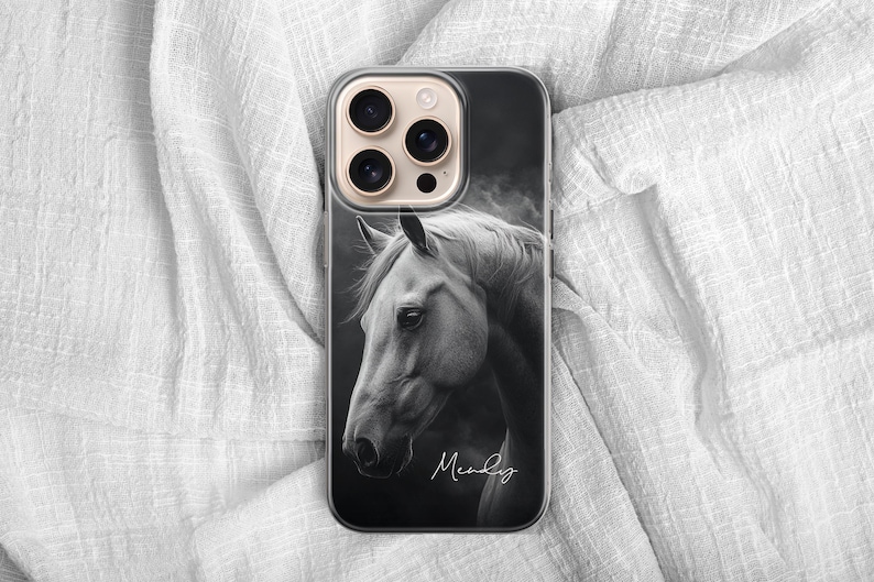 May include: A phone case featuring a black and white image of a horse's head. The horse is facing left, with its mane and face in sharp detail. The name "Mendy" is written in cursive at the bottom.
