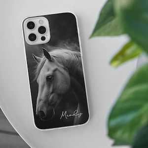 May include: A phone case featuring a black and white image of a horse's head. The image has a soft, artistic quality. The case has a clear border and the name "Mandy" is written in cursive at the bottom.