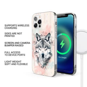 May include: A clear phone case with a wolf illustration on a pink and blue watercolor background. The case is compatible with wireless charging and has a raised bumper to protect the screen and camera.