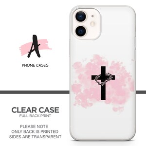 May include: A clear phone case with a pink watercolor background and a black cross with a crown of thorns. The text "PLEASE NOTE ONLY BACK IS PRINTED SIDES ARE TRANSPARENT" is printed on the case.