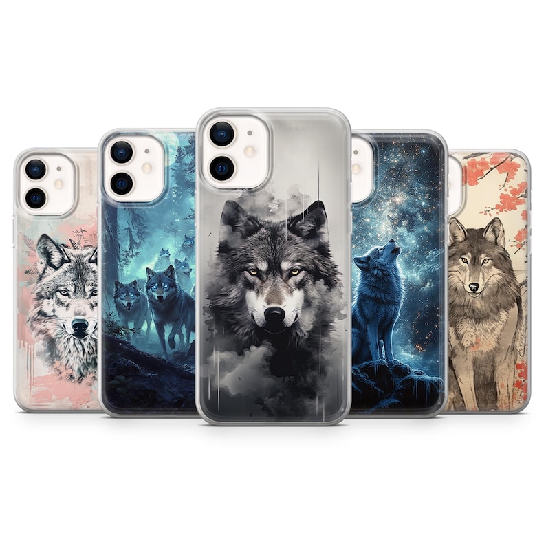 May include: Five different iPhone cases with wolf designs. The cases are clear and show the wolf designs through the plastic. The wolf designs include a wolf howling at the moon, a wolf in a forest, a wolf with a starry background, and a wolf in a Japanese style.