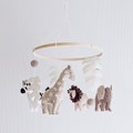 Safari mobile in neutral colors. Savannah animals baby mobile. Safari baby mobile product logo