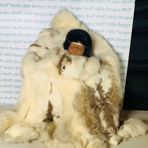 Papoos doll with real rabbit fur wicker basket