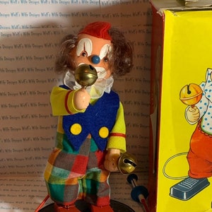 Sonni 1950s vintage clown toy. Movable toy. Push button and still moves. Classic vintage toy collectible.