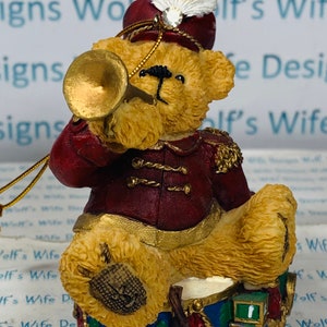 Christmas bear ornament with trumpet sitting on drums little drummer bear