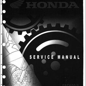 May include: Black and white service manual cover for a Honda motorcycle. The cover features a stylized image of gears and the text "SERVICE MANUAL" and "FSC600/A SILVER WINGTM".