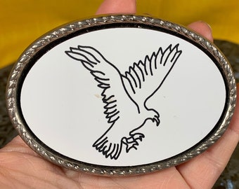 white belt buckle with eagle carved into it fits 1 3/4 inch wide belt