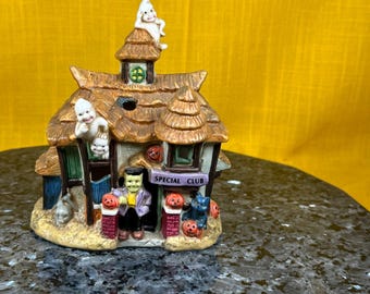 Halloween porcelain ligh up house so stinking cute says Special Club cord not in photos is included & green purple orange white light