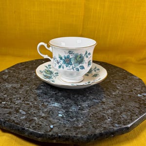 Queen Anne made in England, tea cup, and saucer, set #8500 beautiful blue on white floral bone China