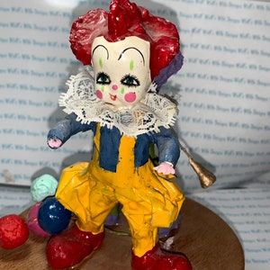 1960 Papier-mâché clowns on top wooden music playing pedestal paper mache clown