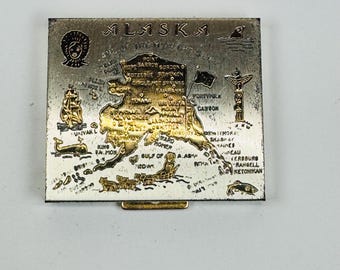 Vintage 1940s to 1950s compact with the state of Alaska empty mirror intact, original puff included