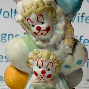 Bisque porcelain clown collectible two little clowns with about a dozen little balloons pastel colors