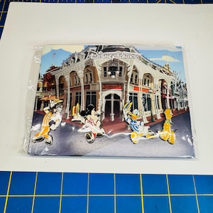 Disney parks Dapper Dans pin set featuring Mickey, Goofy, Donald and Pluto never opened