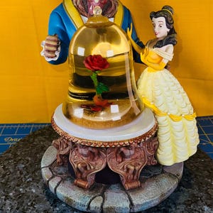 Disney’s Beauty and the Beast 1991 Disney park’s figurine with rose under glass dome wayer globe no lights motor not working music works