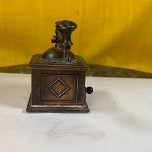 Durham industries mini brass coffee grinder, not actual coffee grinder for decoration only discoloration needs care