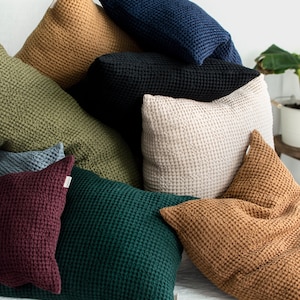 bundle of linen throw pillows in various colors