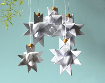 Handmade paper stars according to Fröbel – set of five stars refined with silver color