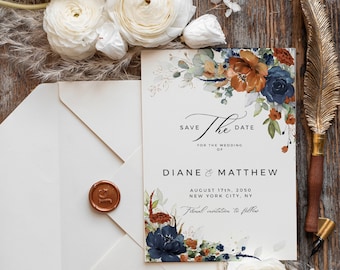 May include: Save the date wedding invitation with a watercolor floral design in shades of blue, orange, and green. The text reads "Save the Date for the Wedding of Diane & Matthew August 17th, 2050 New York City, NY Formal invitation to follow."